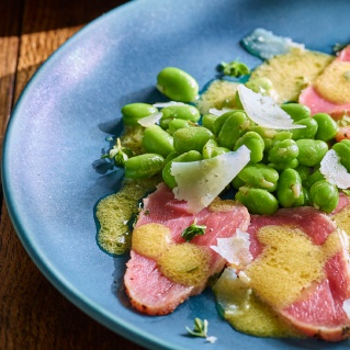 Veal carpaccio with broad beans and truffle olive oil